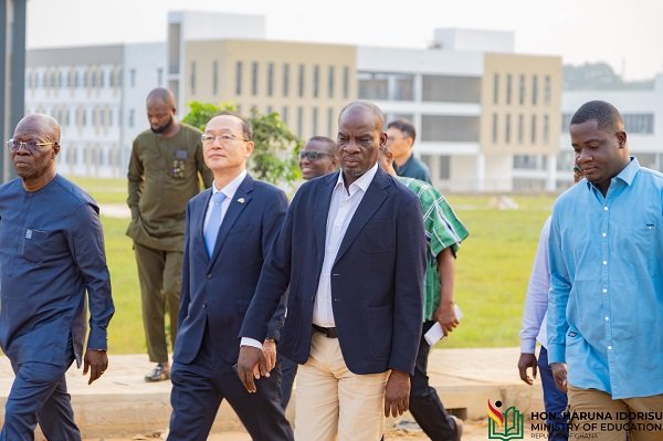 Mr Haruna Iddrisu being conducted round the facility. With him are Mr Park Kyongsig (second right) and Prof Asamoah (first right)