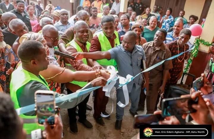 -Mr Gunu (fouth from left) being assited by Mr Agbana (fourth from right) and other dignitaries to cut the tape and inaugurate the facility.