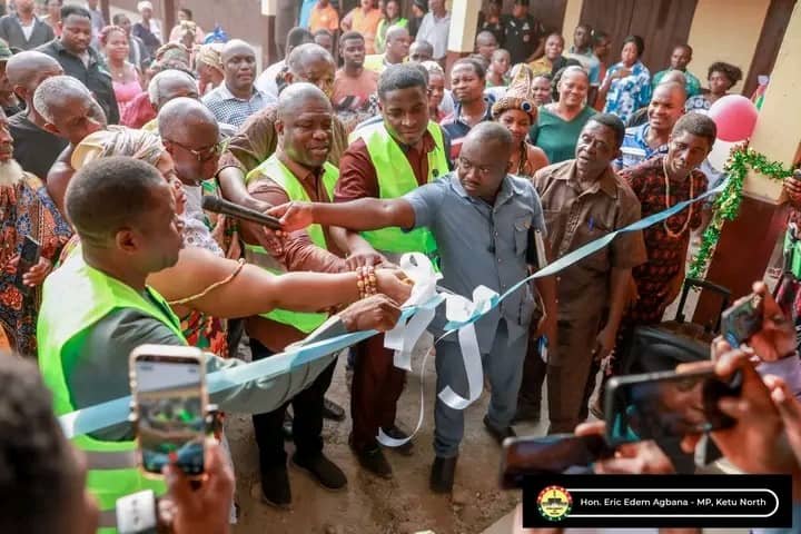 -Mr Gunu (fouth from left) being assited by Mr Agbana (fourth from right) and other dignitaries to cut the tape and inaugurate the facility.