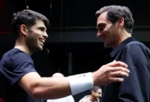 Carlos Alcaraz (left) with Roger Federer