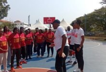 Coach Touomou and assistant Robert interacting with the coaches