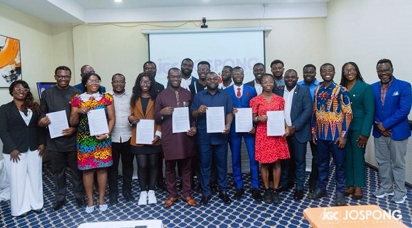 • Dr Agyepong with President and members of the GSD displaying copies of the MoU