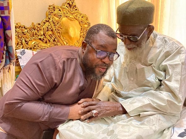 • Alhaji Osumanu (left), receiving blessing from the National Chief Imam, Sheikh Dr Osman Nuhu Sharubutu
