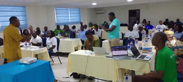 Mr Tagoe (left) addressing participants in the conference