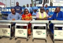 Alhaji Faila(second left) presenting the furniture to the schools