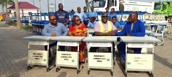 Alhaji Faila(second left) presenting the furniture to the schools
