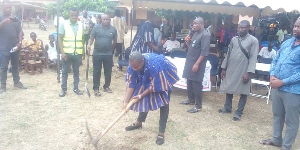 Mr Addison Dodzi Mornyuie breaking the ground for work to start on the six unit classroom block project