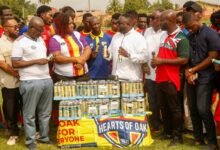 Mr Adjei (right) delivering his speech ahead of the presentation to Madam Marku Mensah
