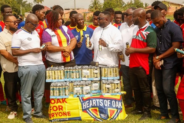 Mr Adjei (right) delivering his speech ahead of the presentation to Madam Marku Mensah