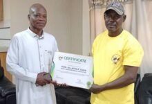 • Mr Issifu Basideen (right) presenting the certificate to Northern Regional Minister, Mr Ali Adolf John Mburidiba