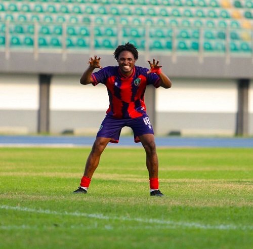 • Muna celebrating his second goal for Eleven Wonders