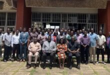 • Mr Taylor (seated second from left) with some staff of CSIR after the visit