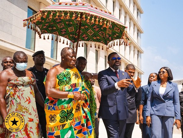 • Dr Asiama (middle) and Otumfuo Osei Tutu II touring the the bank facility