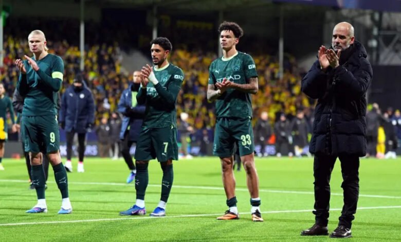 Pep Guardiola leads his players to acknowledge cheers from the City fans after the game