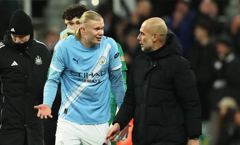 Pep Guardiola talks with Erling Haaland after the match