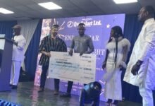 • Mr Joseph Akl presenting a dummy cheque to one of the awardees