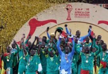 Sadio Mane lifts the AFCON trophy with teammates as they celebrate their success