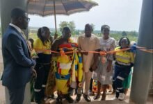 • Barima Twereku Ampem (third from left) cutting the ribbon to open the hostel (inset) for Ntotroso Nurses and Midwifery Training College. Looking on are NADeF officials