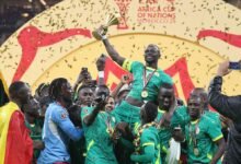 Senegal's Sadio Mane holds the trophy as they celebrate their success