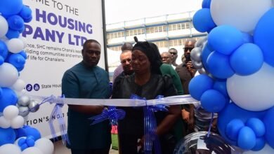 Mr Gilbert Adjei (left) assisting Mrs Sarpong to cut the tape to open the facility Photo Seth Osabukle