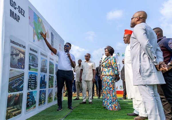 • Mr Kwame Asare Obeng with mic explaining the project to Vice President Professor Naana Jane Opoku-Agyemang (middle)