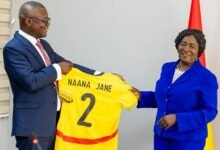 Mr Kofi Adams presenting a copy of Jasey to the Vice President Professor Opoku-Agyemang