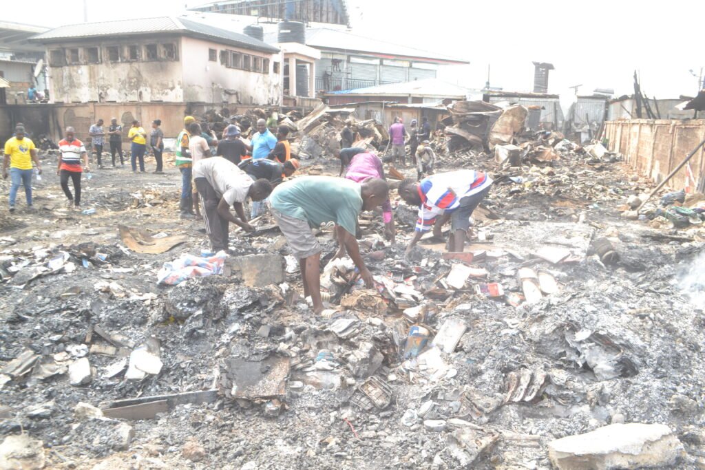 Victims and scavengers going through the debris Photo Victor A. Buxton