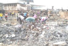 Victims and scavengers going through the debris Photo Victor A. Buxton