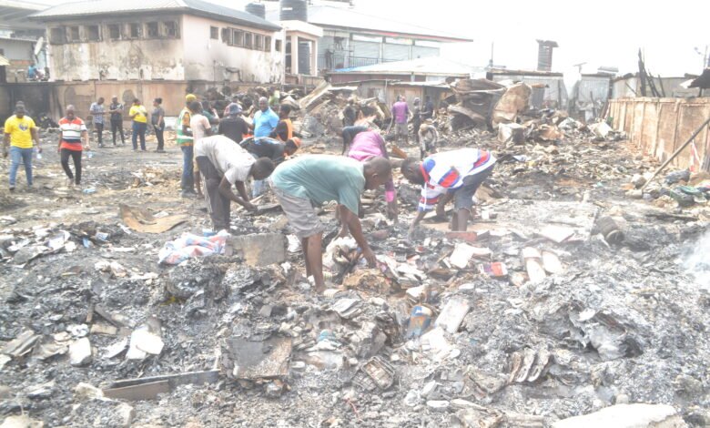 Victims and scavengers going through the debris Photo Victor A. Buxton