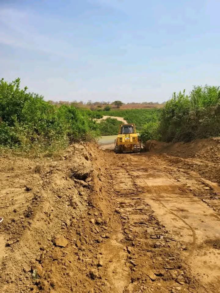 bulldozers clearing the way for construction of the bridge