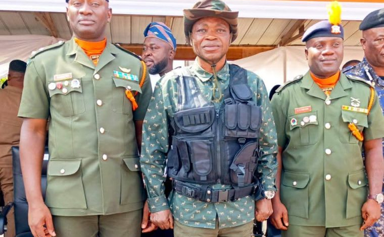Mr Mburidiba (middle) with the two army officers