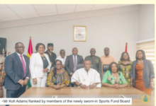 • Mr Kofi Adams flanked by members of the newly sworn-in Sports Fund Board