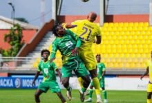 A Medeama player (in yellow) has the advantage in this aerial tussle with Aduana FC players