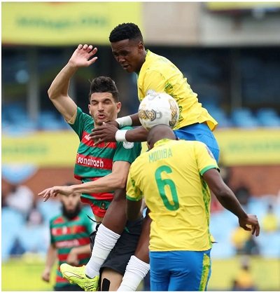 An aerial challenge between players of Sundowns (in yellow) and MC Alger