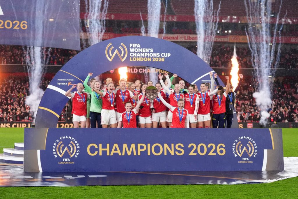 Arsenal lifting the Champions Cup trophy