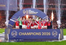Arsenal lifting the Champions Cup trophy