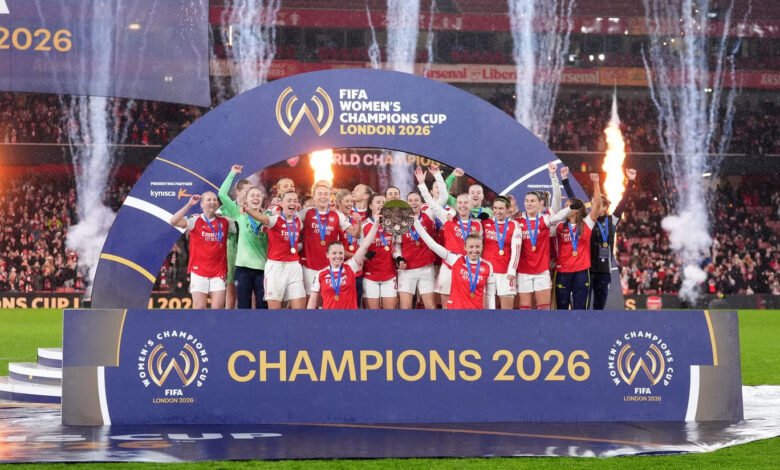 Arsenal lifting the Champions Cup trophy