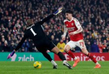 Arsenal's Kai Havertz in action with Chelsea's Robert Sanchez before he scores their first goal
