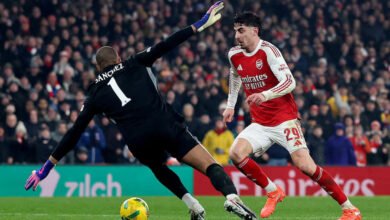 Arsenal's Kai Havertz in action with Chelsea's Robert Sanchez before he scores their first goal