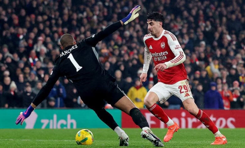 Arsenal's Kai Havertz in action with Chelsea's Robert Sanchez before he scores their first goal