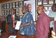 Mr Nketia (left) presenting the report to Mr Ibrahim Photo Victor A. Buxton