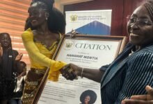Mrs Gomashie (right) presenting a citation to Ms Hamamat