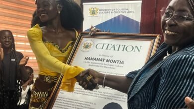Mrs Gomashie (right) presenting a citation to Ms Hamamat