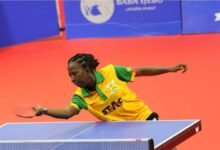 Cynthia Kwabi returns a serve in the final match