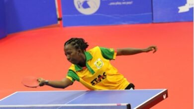 Cynthia Kwabi returns a serve in the final match