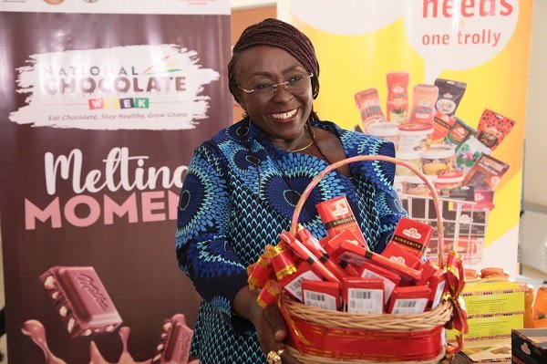 Ms Dzifa Gomashie with a busket full of chocolate