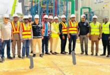 ECG CWM Pix----- Dr Amuna (fourth from left) with Mr Kpekpena and management of Aksa Energy