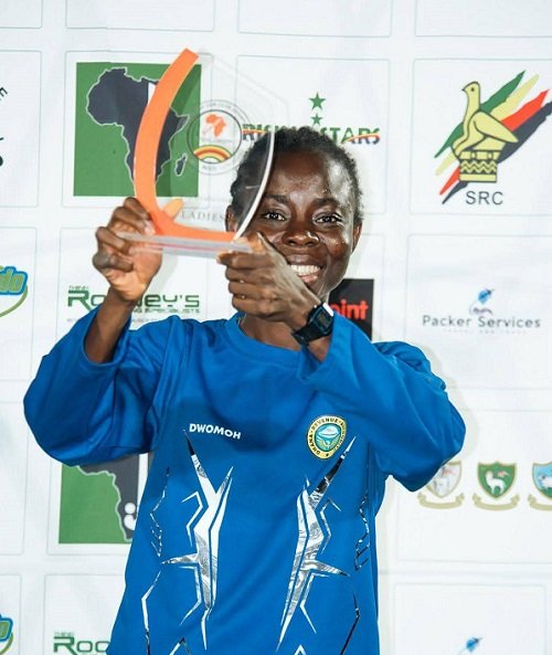 • Elizabeth Opoku display ing her top scorer award