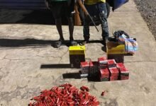 The two suspects with the gun and the ammunitions