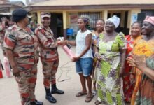 ACFO Darko( second from left) presenting a fire extinguisher to the Apremdo team